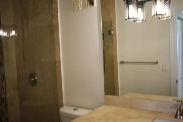 a toilet sitting next to a bathroom sink