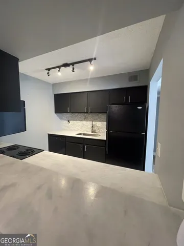 a bedroom with a bed and a mirror