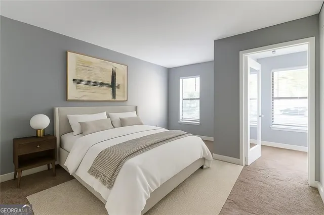 a bedroom with bed and window