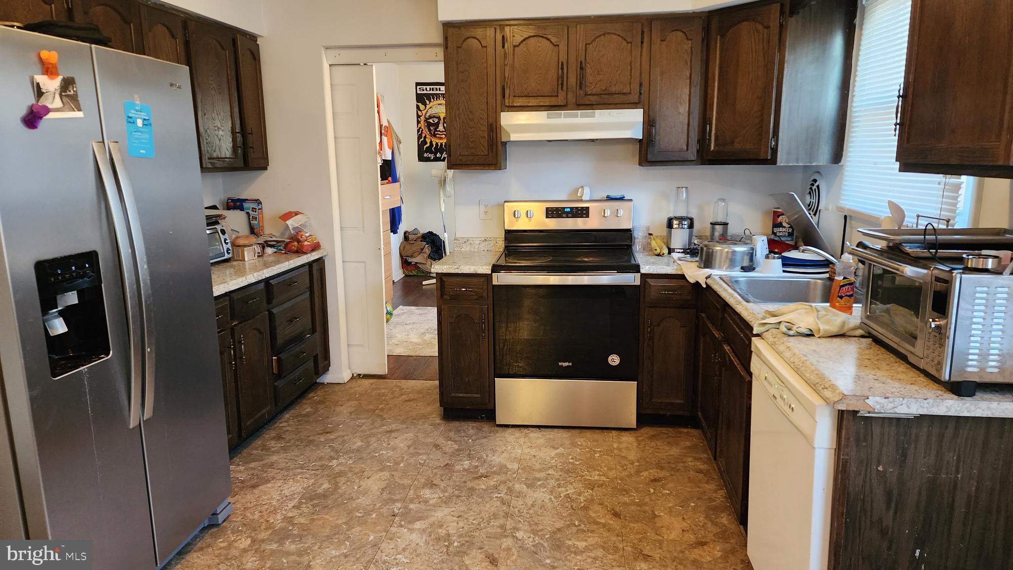 111 A Franklin Road Glassboro, NJ 08028 - Photo 3 of 13 a kitchen with stainless steel appliances granite countertop a refrigerator stove a sink and dishwasher