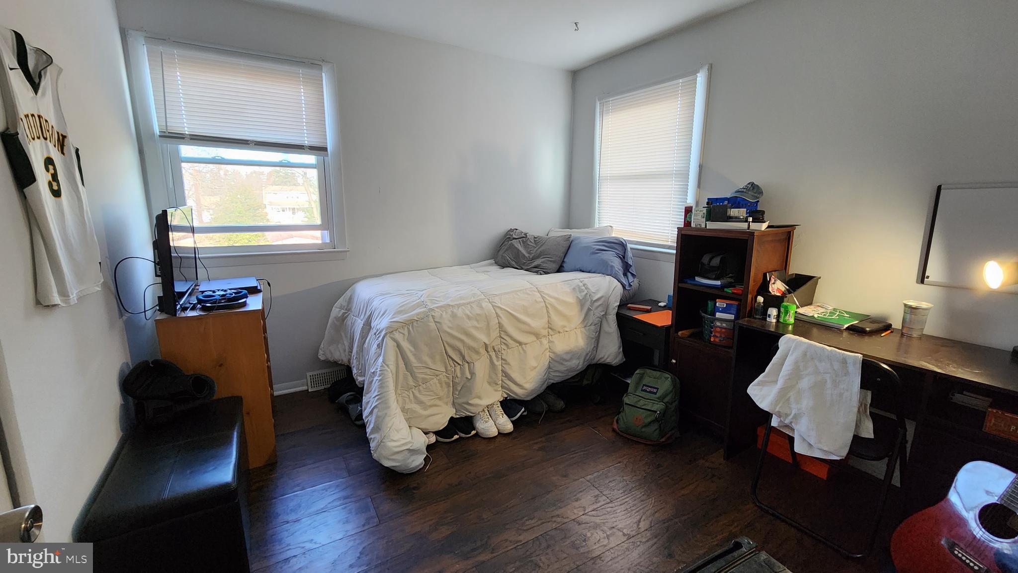 111 A Franklin Road Glassboro, NJ 08028 - Photo 6 of 13 a bed room with a bed tv and a window