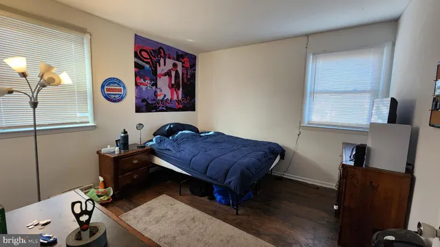 a bedroom with a bed and a table in it