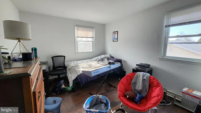 a room with a workspace and a window