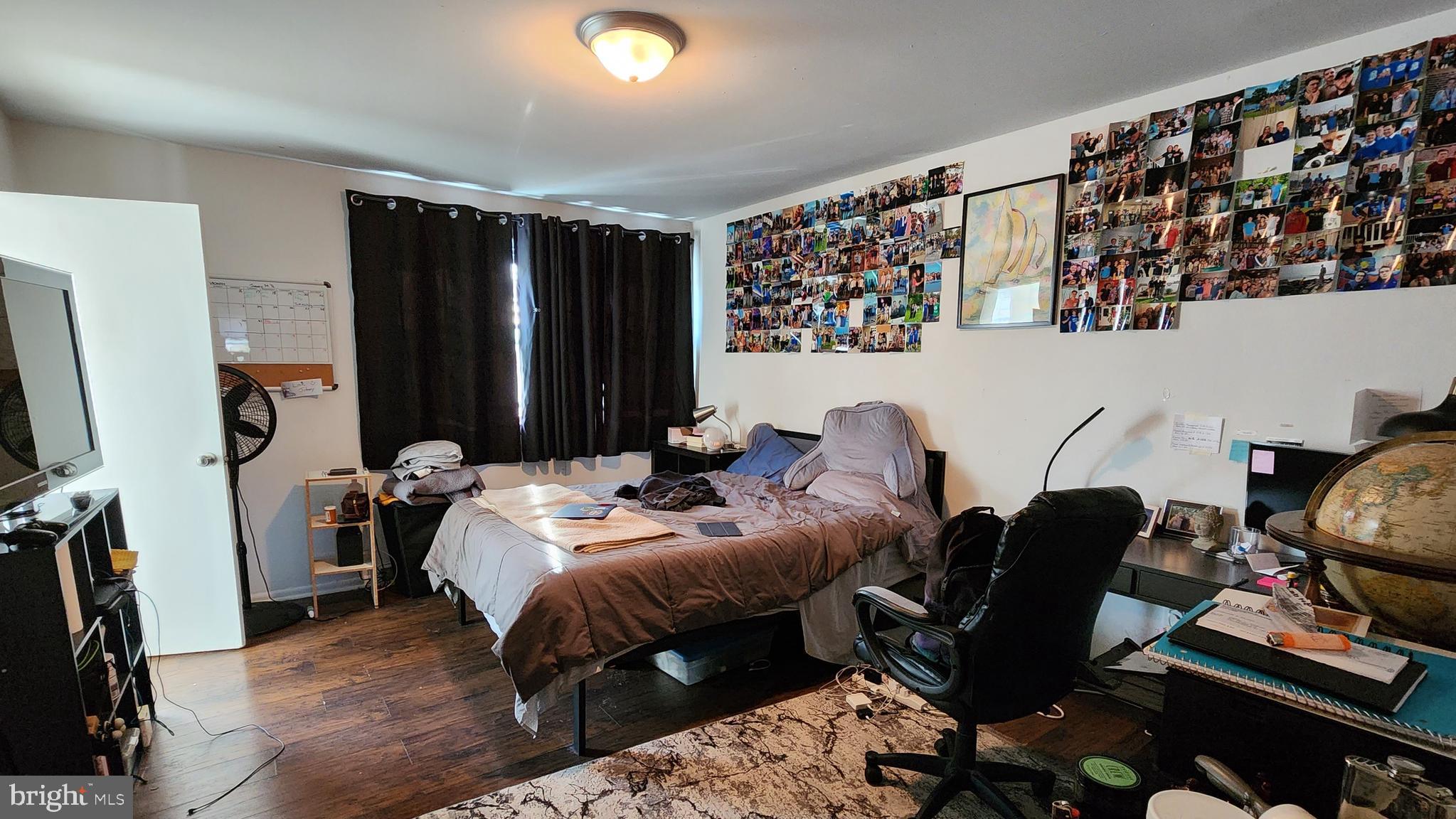 111 A Franklin Road Glassboro, NJ 08028 - Photo 10 of 13 a bed room with a bed and a television