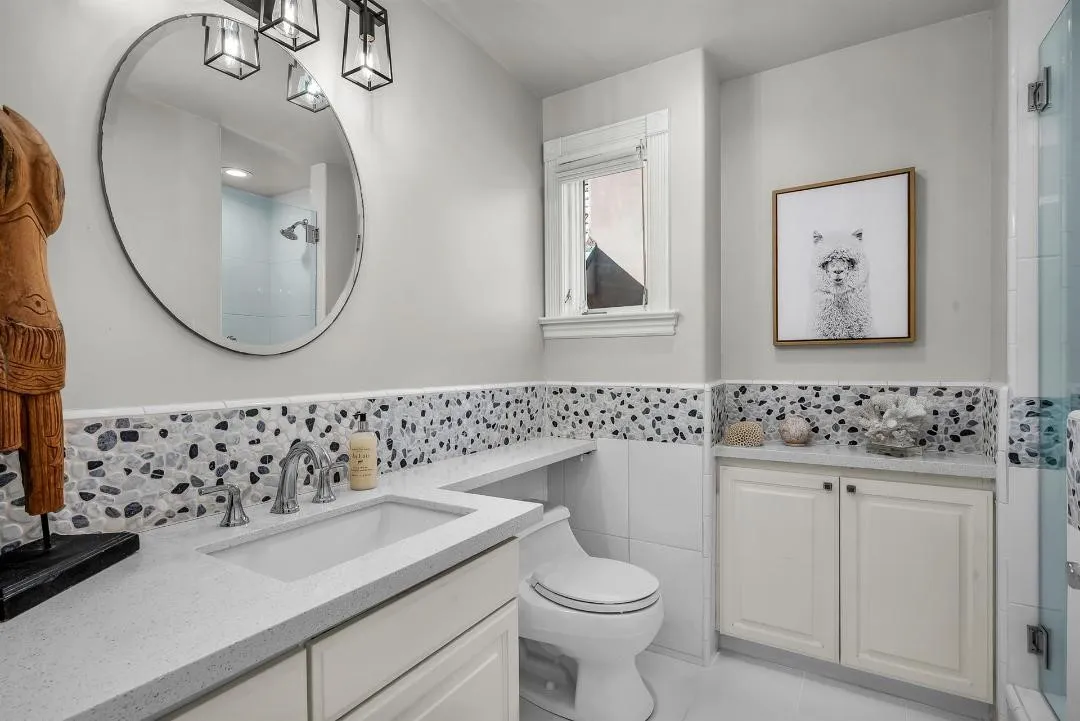 47 Surfside Avenue Surfside, CA 92649 - Photo 28 of 37 a bathroom with a sink and a mirror