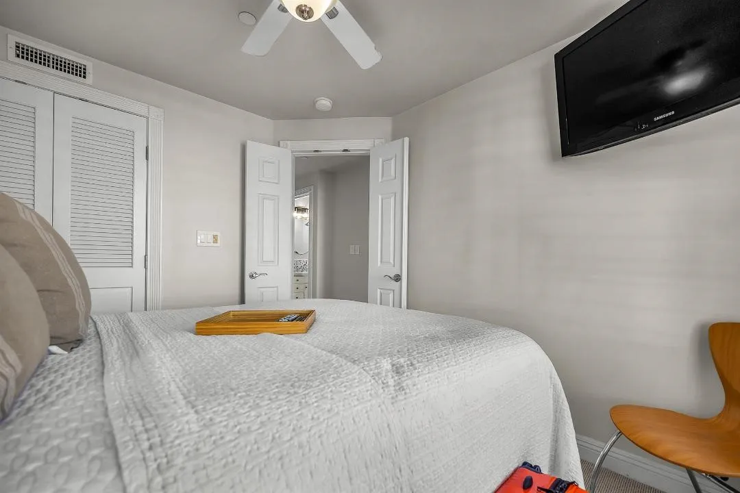 47 Surfside Avenue Surfside, CA 92649 - Photo 31 of 37 a bedroom with a bed and a flat screen tv