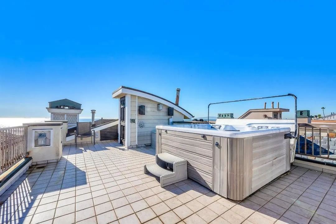 47 Surfside Avenue Surfside, CA 92649 - Photo 32 of 37 a view of a chairs and table in a patio