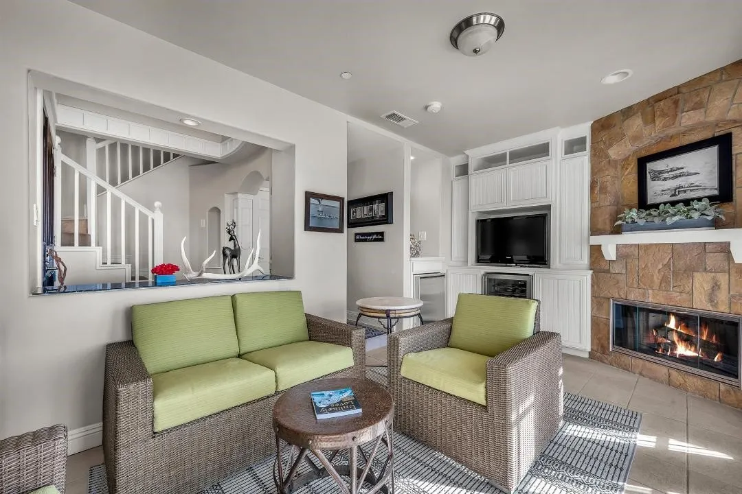 47 Surfside Avenue Surfside, CA 92649 - Photo 6 of 37 a living room with furniture and a flat screen tv