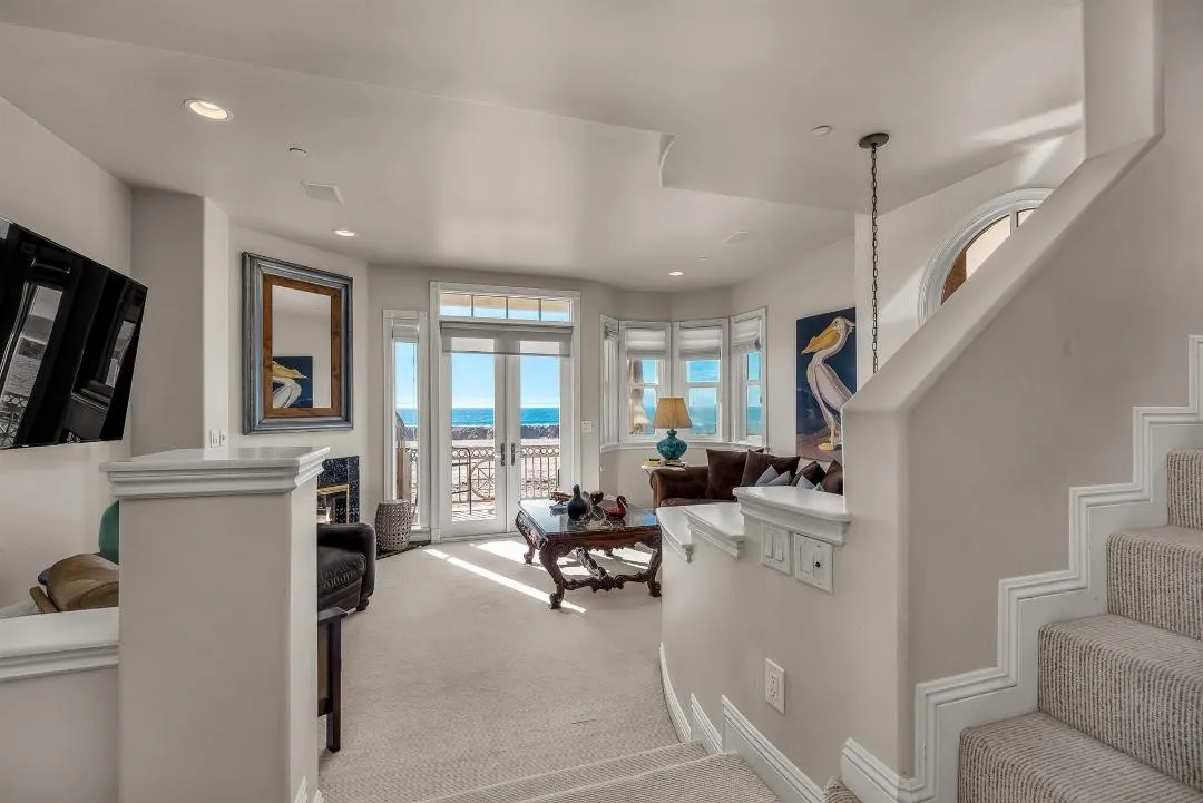 47 Surfside Avenue Surfside, CA 92649 - Photo 9 of 37 a living room with furniture and a flat screen tv