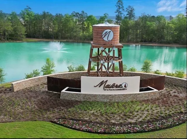 a sign on the side of a lake