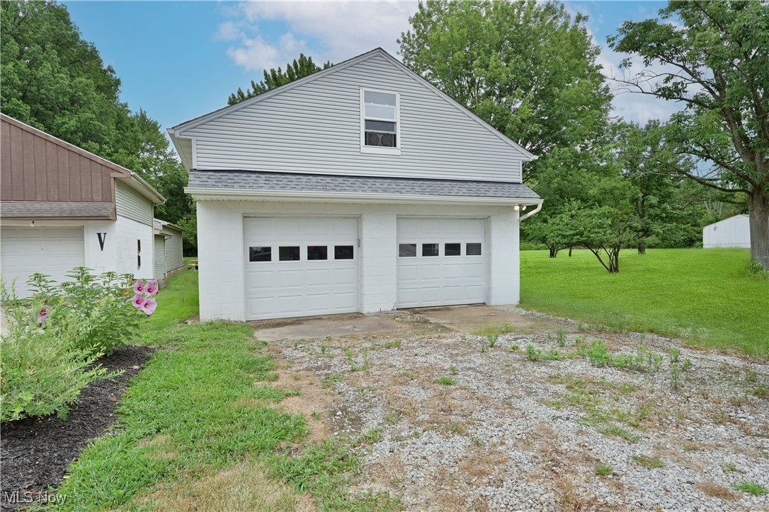 6379 Avon Belden Road North Ridgeville, OH 44039 - Photo 20 of 26 The oversized 2-car garage includes automatic garage door openers and offers an abundance of space—ideal for vehicles, storage, a workshop, or even future expansion with the large loft above