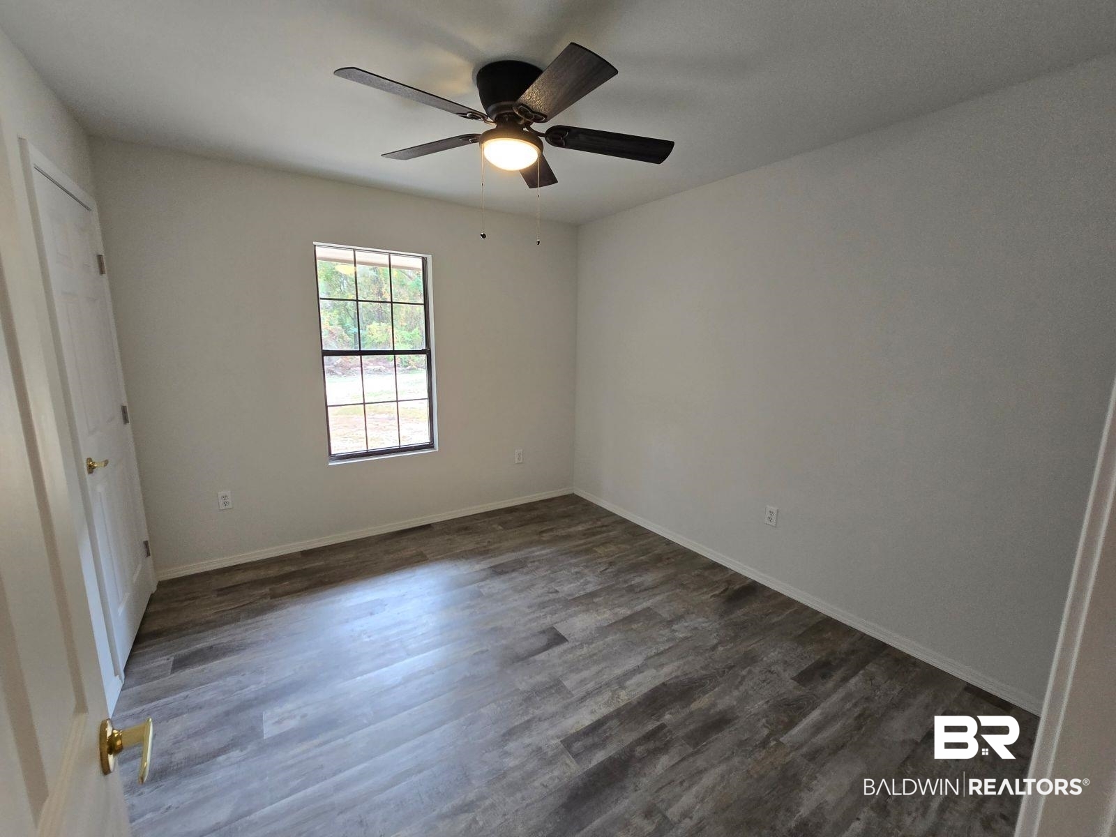 1600 Blair Road Brewton, AL 36426 - Photo 15 of 15 Spare room with ceiling fan and dark hardwood / wood-style flooring
