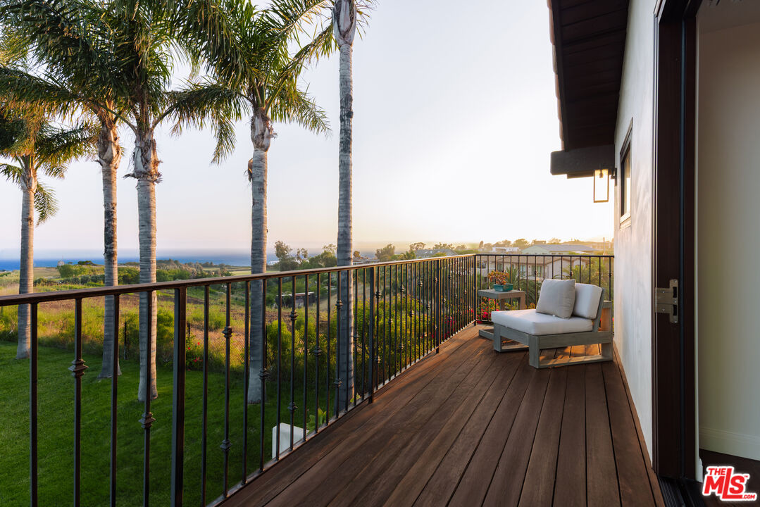 29660 Harvester Road Malibu, CA 90265 - Photo 15 of 45 a view of balcony with couch and wooden floor