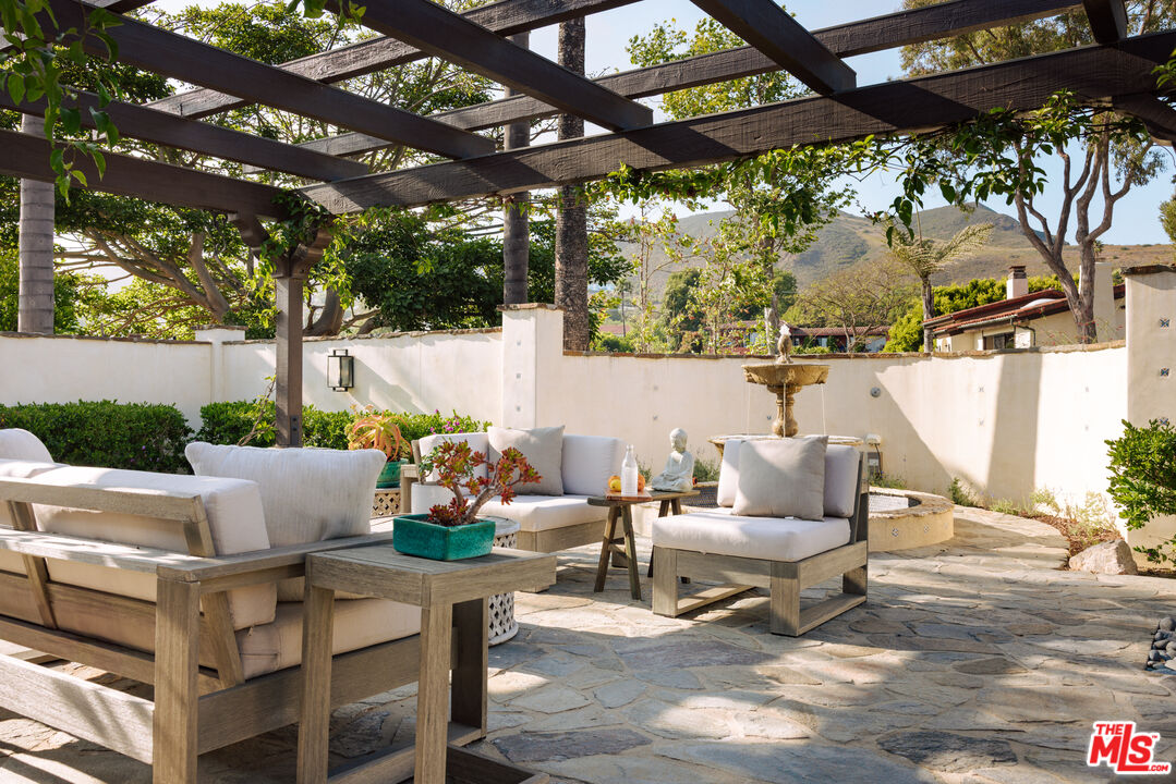 29660 Harvester Road Malibu, CA 90265 - Photo 18 of 45 a outdoor space with couches and large trees