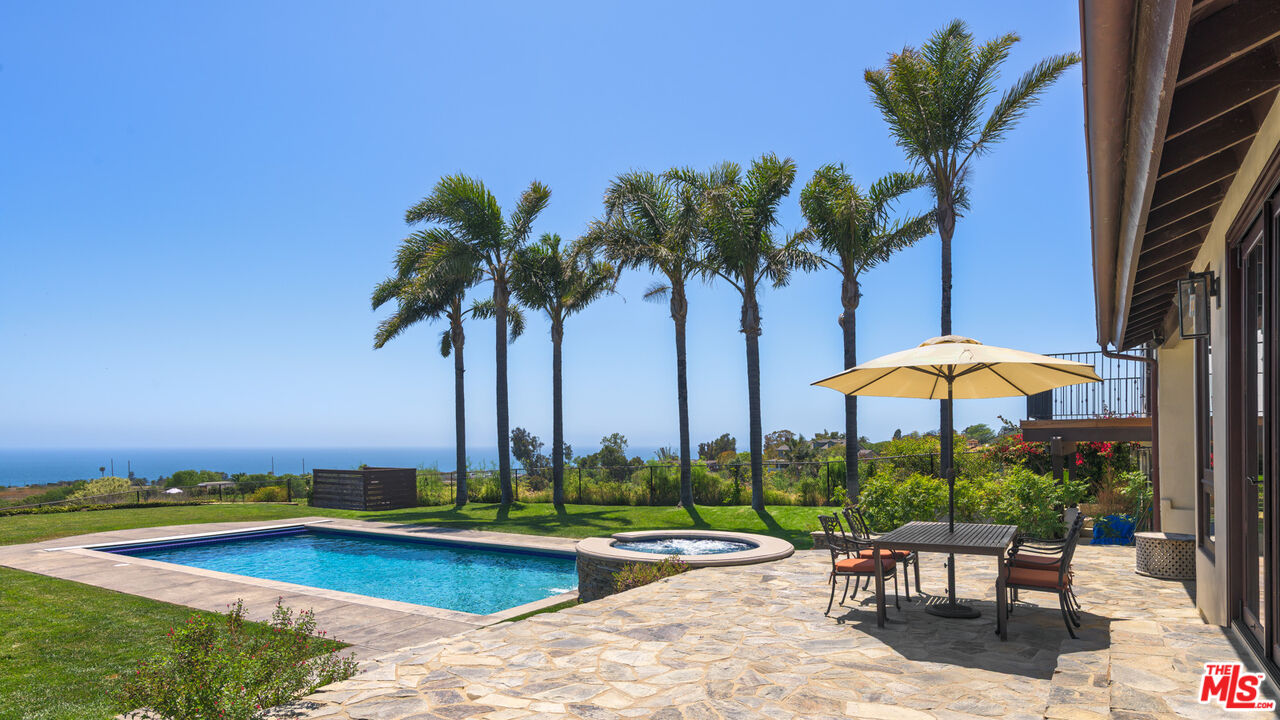 29660 Harvester Road Malibu, CA 90265 - Photo 19 of 45 a view of a backyard with sitting area and furniture