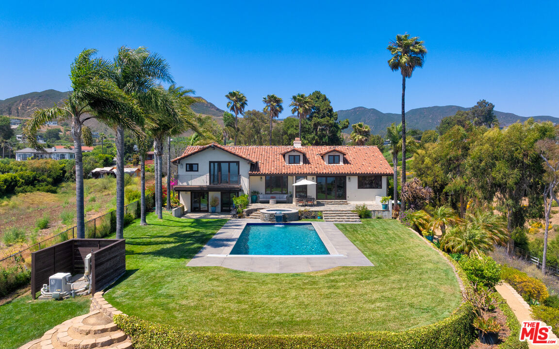 29660 Harvester Road Malibu, CA 90265 - Photo 20 of 45 a swimming pool view with a garden space