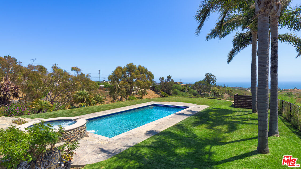 29660 Harvester Road Malibu, CA 90265 - Photo 21 of 45 a view of swimming pool with a yard