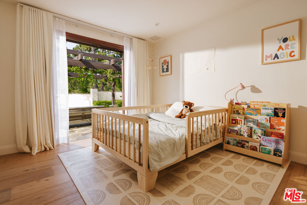 29660 Harvester Road Malibu, CA 90265 - Photo 29 of 45 a bed room with furniture and a window