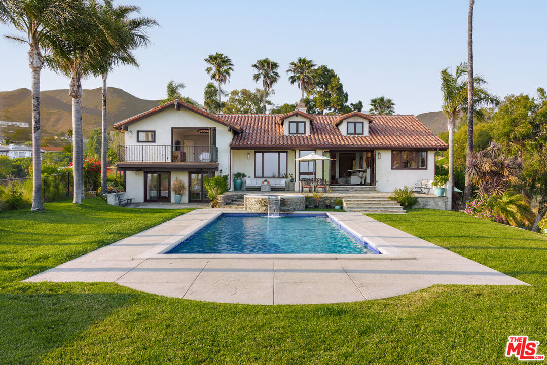 29660 Harvester Road Malibu, CA 90265 - Photo 34 of 45 a front view of a house with garden