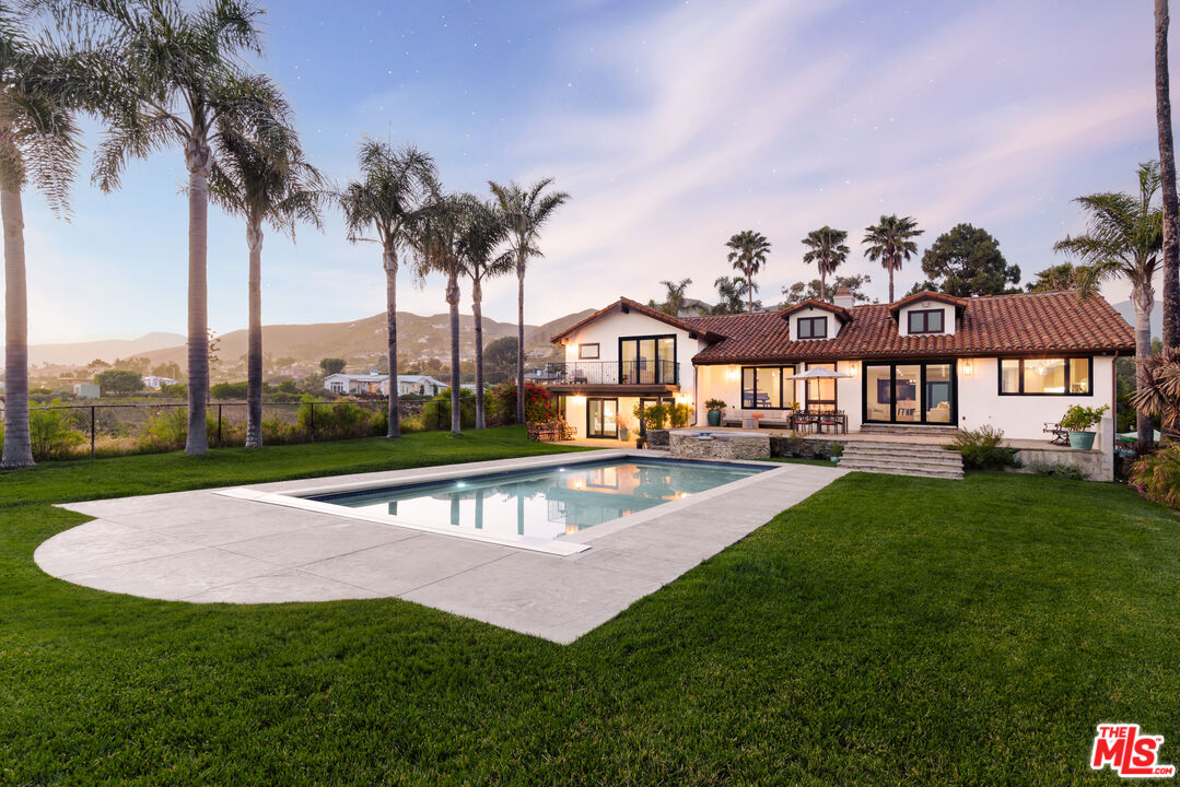 29660 Harvester Road Malibu, CA 90265 - Photo 37 of 45 a view of a swimming pool with a garden