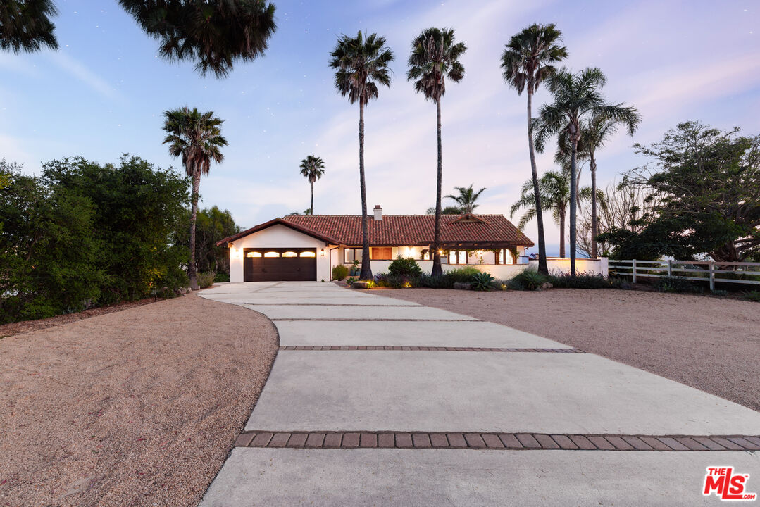 29660 Harvester Road Malibu, CA 90265 - Photo 39 of 45 a view of a street with a palm trees
