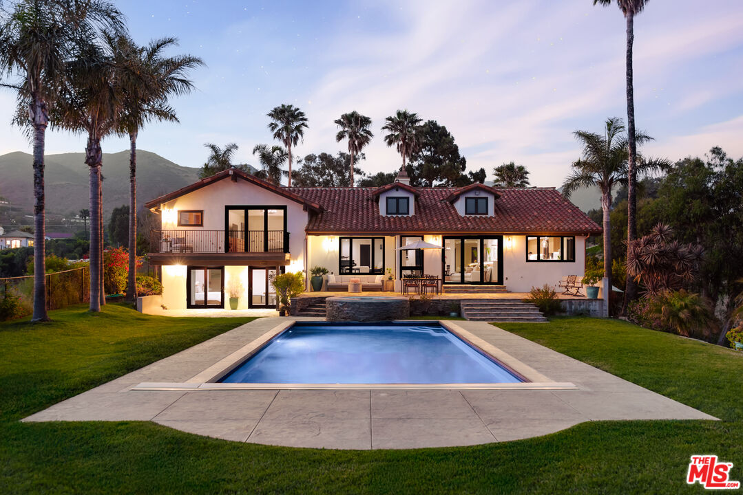 29660 Harvester Road Malibu, CA 90265 - Photo 40 of 45 a view of a house with a swimming pool