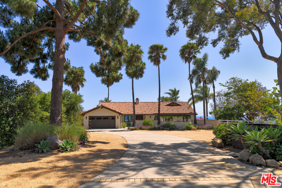 29660 Harvester Road Malibu, CA 90265 - Photo 42 of 45 a view of a garden with a tree