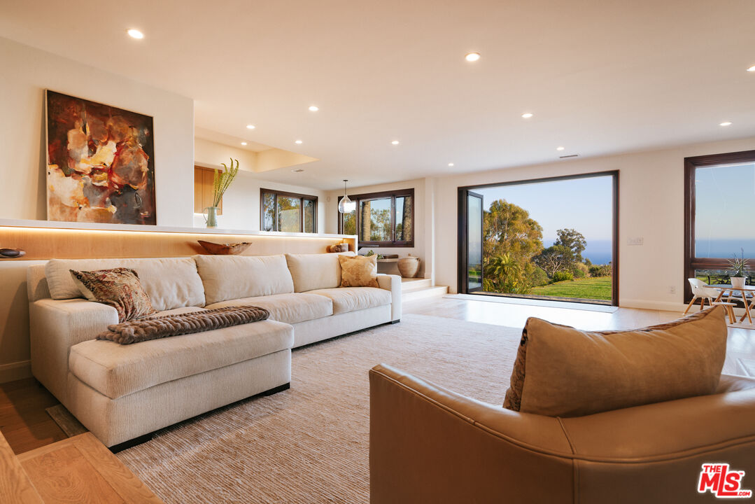 29660 Harvester Road Malibu, CA 90265 - Photo 6 of 45 a living room with furniture and a large window