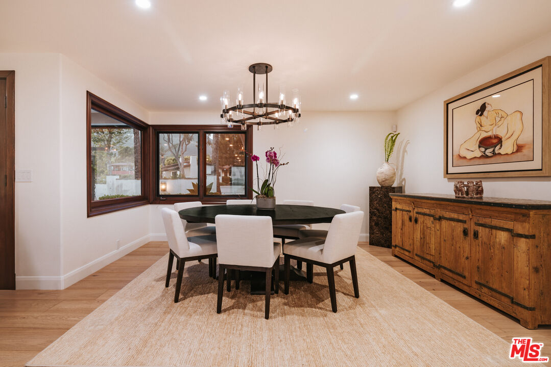 29660 Harvester Road Malibu, CA 90265 - Photo 9 of 45 a view of a dining room with furniture window and wooden floor