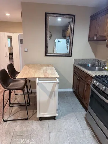 a kitchen with table and chairs