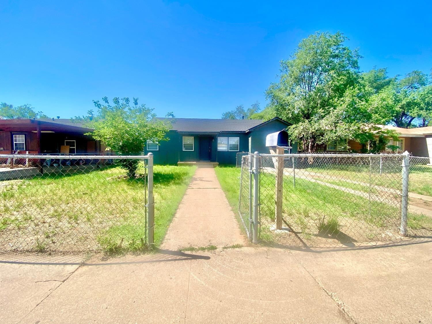 517 54th Street Lubbock, TX 79404 - Photo 2 of 16 a view of a house with a swimming pool