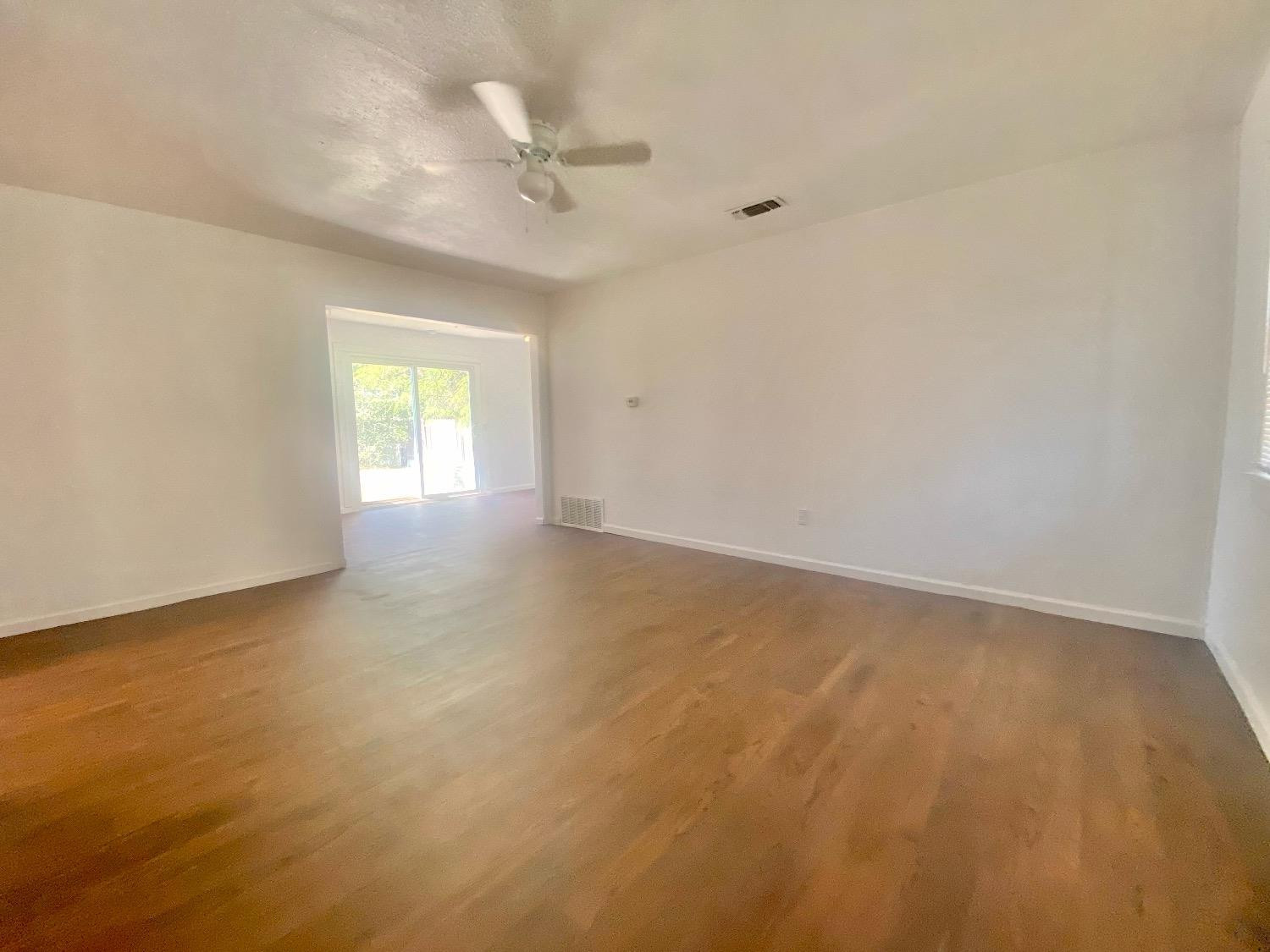 517 54th Street Lubbock, TX 79404 - Photo 4 of 16 a view of an empty room with a window