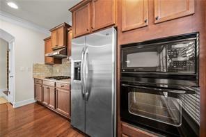 2829 Seneca Creek Lane, Unit 3 Marietta, GA 30067 - Photo 11 of 23 a kitchen with cabinets and stainless steel appliances
