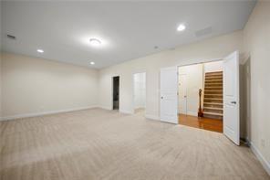 2829 Seneca Creek Lane, Unit 3 Marietta, GA 30067 - Photo 19 of 23 an empty room with closet and natural light