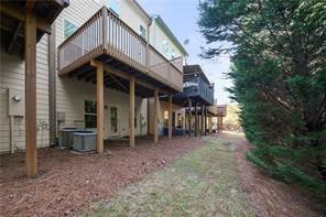 2829 Seneca Creek Lane, Unit 3 Marietta, GA 30067 - Photo 23 of 23 a view of a chairs and table in backyard