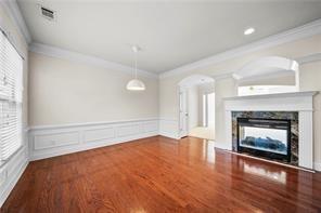 2829 Seneca Creek Lane, Unit 3 Marietta, GA 30067 - Photo 7 of 23 a view of an empty room with a fireplace and a window