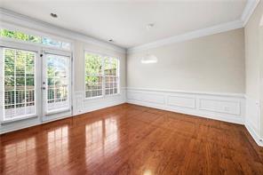 2829 Seneca Creek Lane, Unit 3 Marietta, GA 30067 - Photo 9 of 23 wooden floor in an empty room with a window