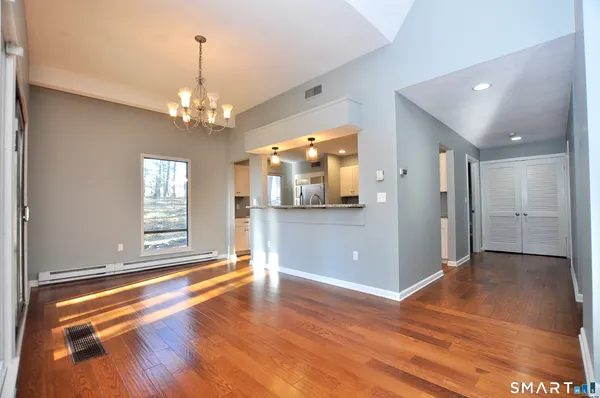 a view of livingroom with kitchen and window