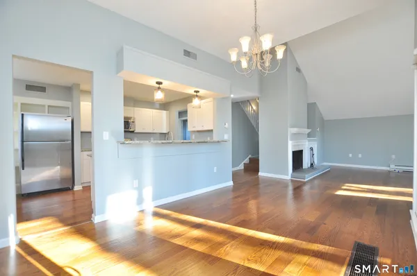 a view of a kitchen with granite countertop a living room