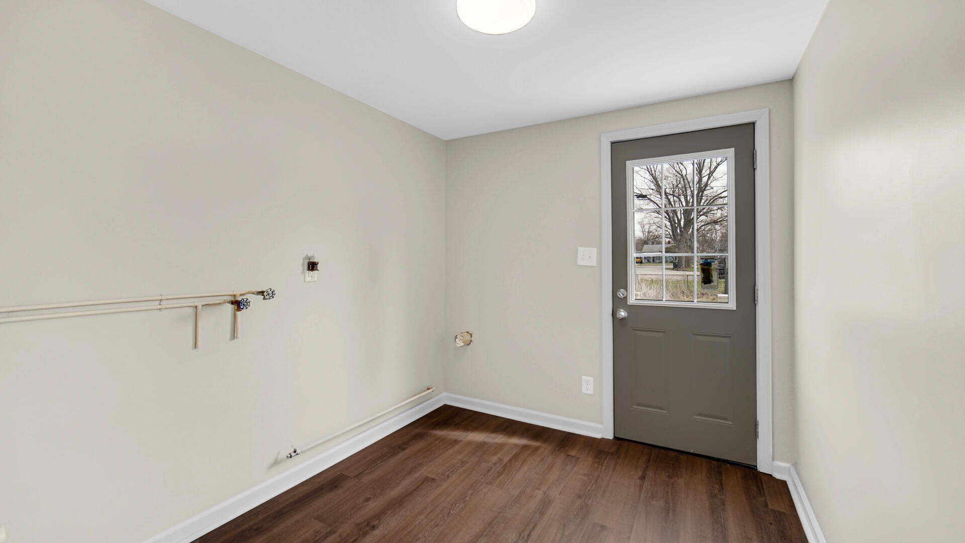 337 North Dearborn Street Hobart, IN 46342 - Photo 11 of 19 a view of an empty room with wooden floor and a window