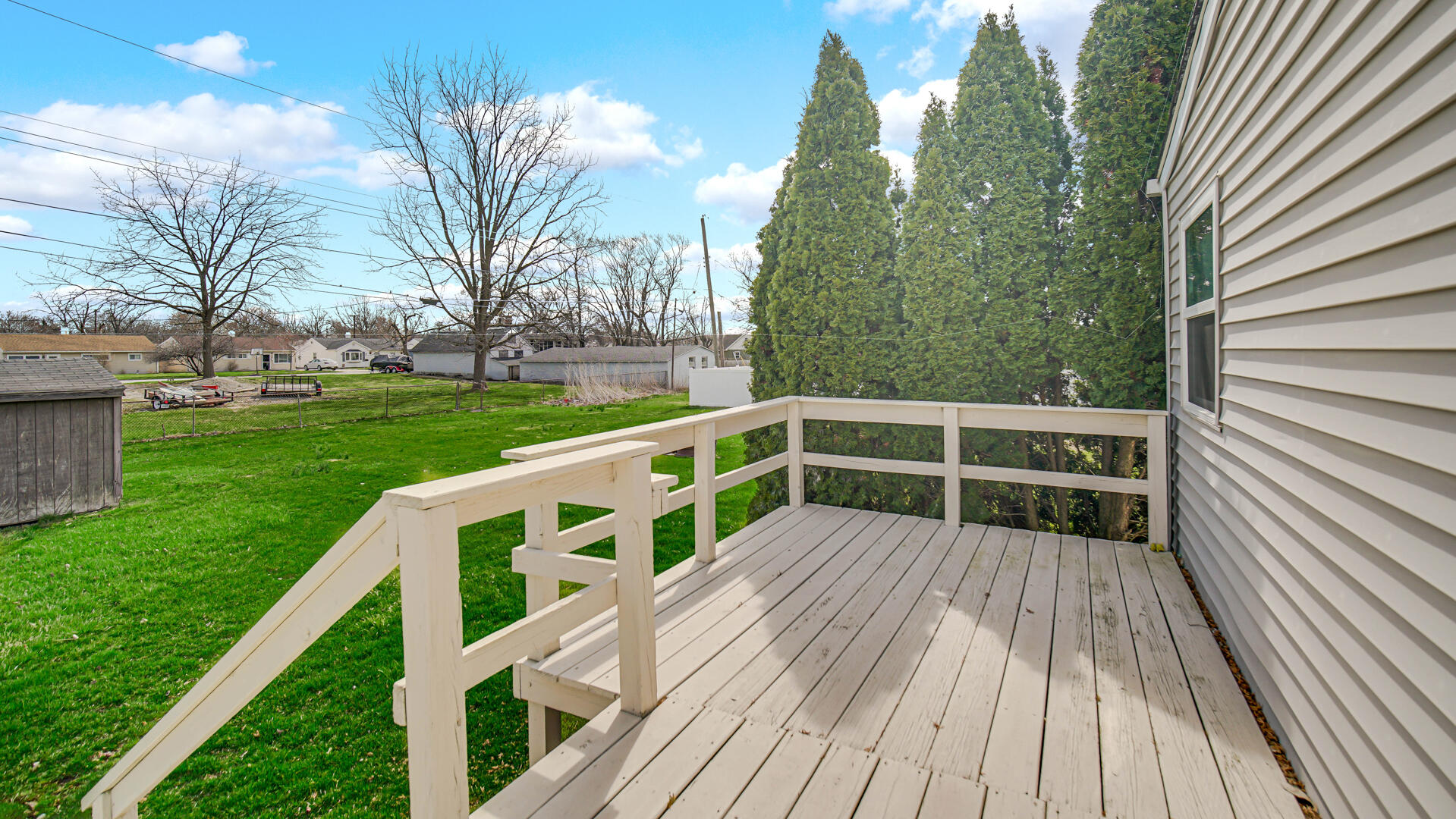 337 North Dearborn Street Hobart, IN 46342 - Photo 18 of 19 a view of deck with large trees and wooden fence
