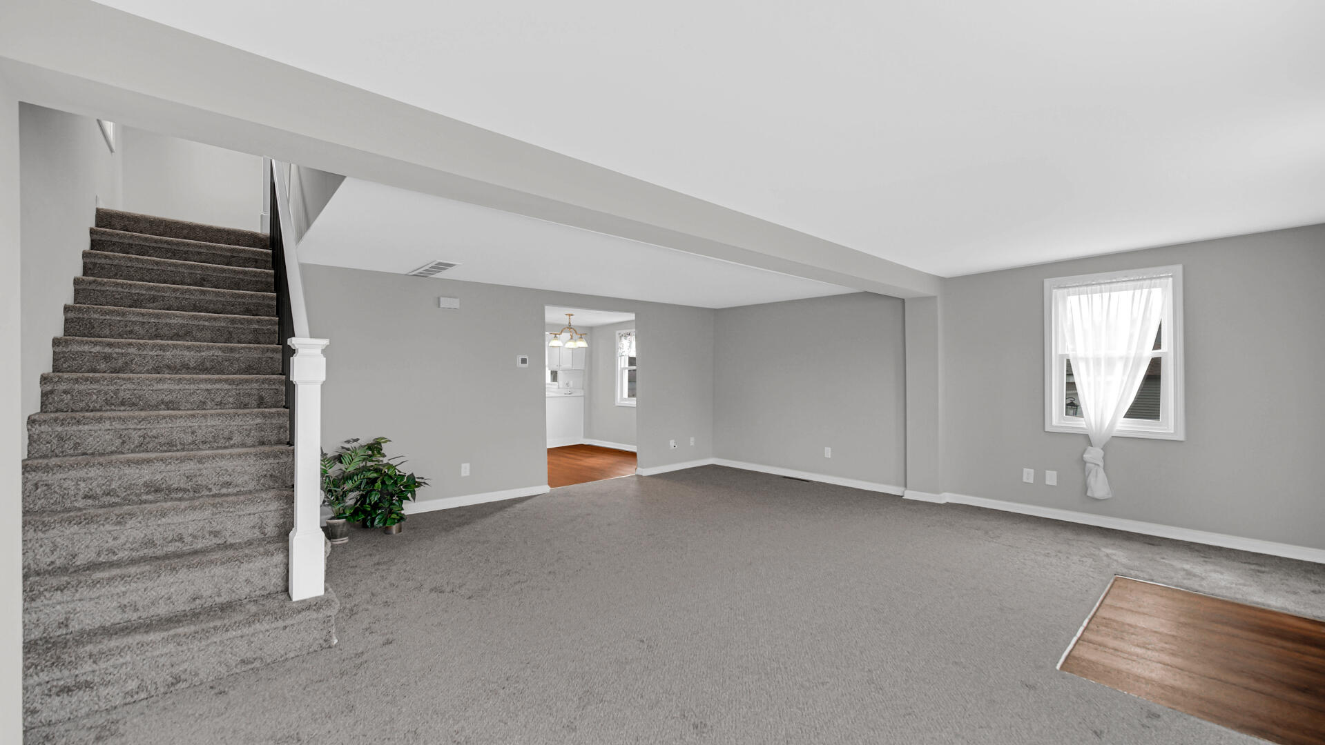 337 North Dearborn Street Hobart, IN 46342 - Photo 5 of 19 an empty room with windows and flowerpot