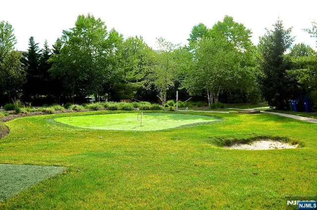 a room with pool table and windows
