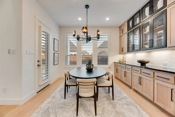 a kitchen with stainless steel appliances kitchen island granite countertop a sink and cabinets
