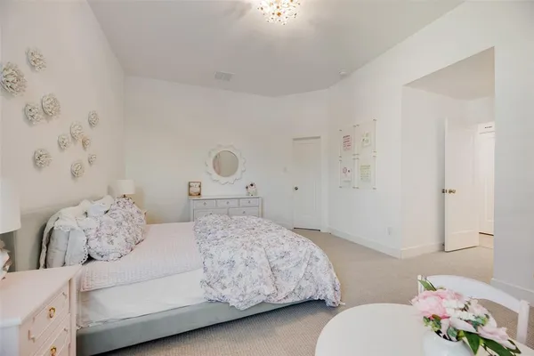 a bedroom with a bed and a couch