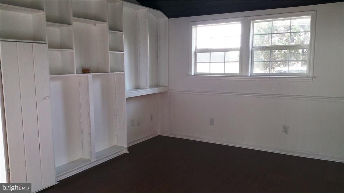 12207 Line Road Delmar, DE 19940 - Photo 8 of 23 an empty room with wooden floor and windows