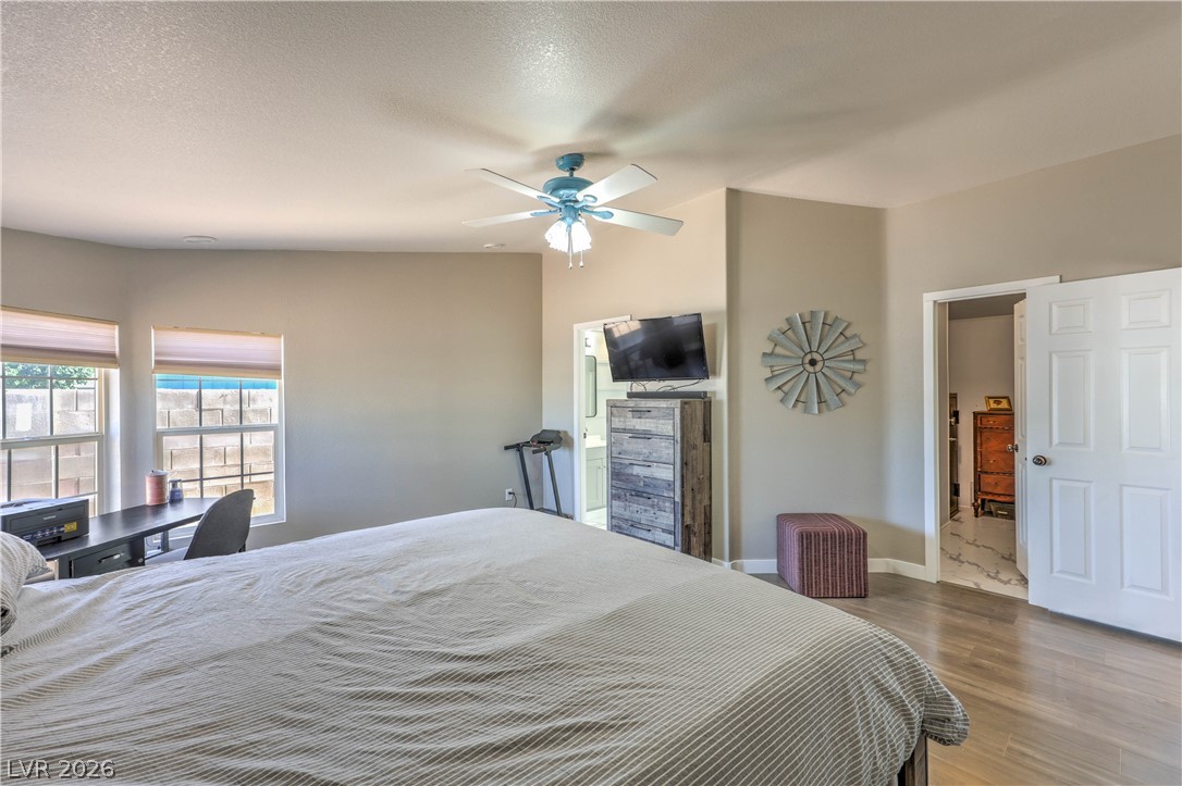 348 Tres Palomas Street Overton, NV 89040 - Photo 18 of 41 Well-lit sleeping quarters with a dedicated work area offer versatile living.