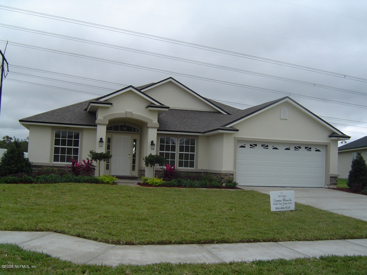 929 Raindrop Lane Middleburg, FL 32068 - Photo 1 of 1 a front view of a house with a yard and garage