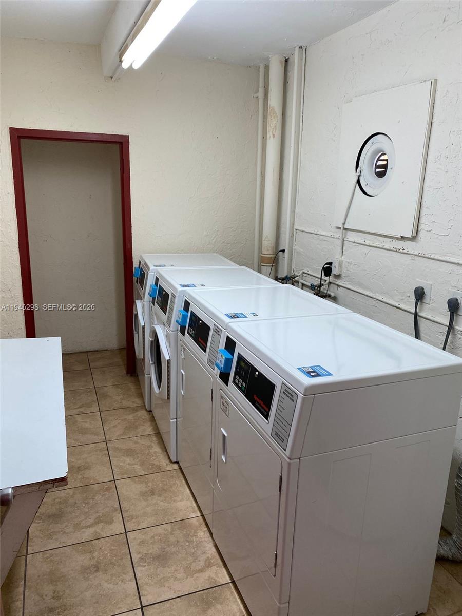 4805 Northwest 7th Street, Unit 10315 Miami, FL 33126 - Photo 20 of 22 a utility room with washer and dryer