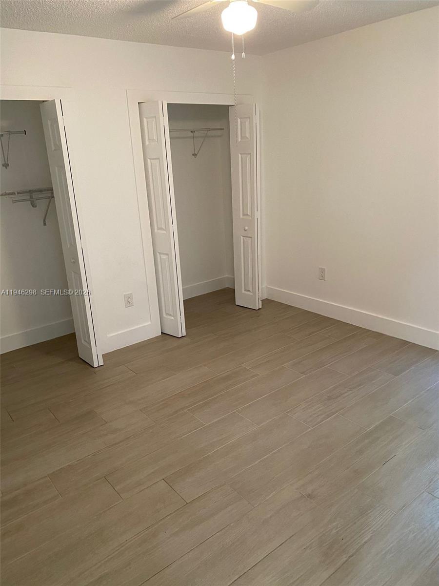 4805 Northwest 7th Street, Unit 10315 Miami, FL 33126 - Photo 10 of 22 an empty room with windows